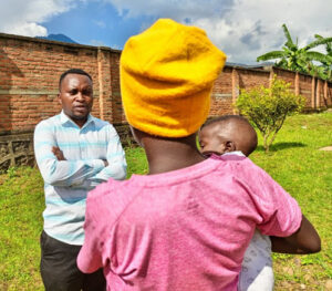 A journalist interviews Eugenie Iradukunda, a 15-year-old teen mother, as she shares her experiences